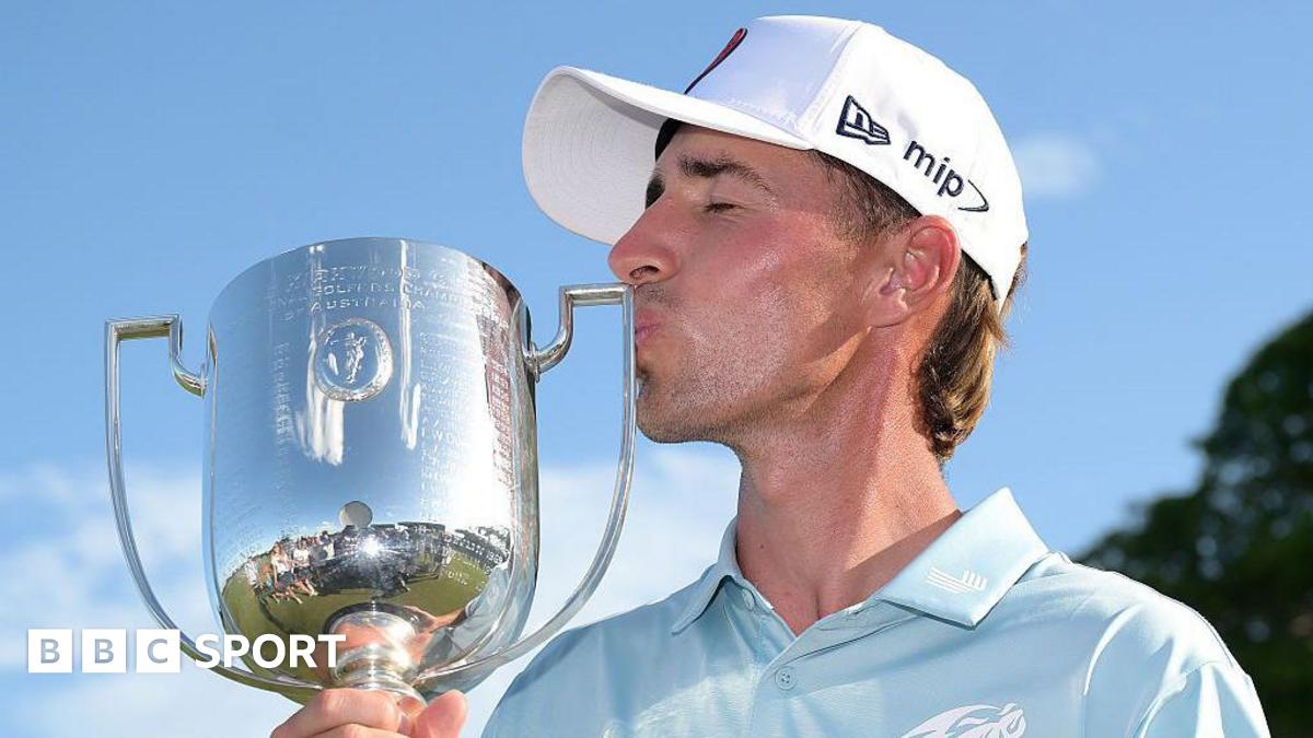 David Puig kissing the Australian PGA Championship trophy