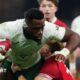 Siya Kolisi powers through a tackle from Cardiff flanker Alex Mann
