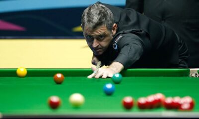 Snooker player Ronnie O&#039;Sullivan takes a shot, with red, yellow, green, brown and blue balls visible