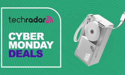 Sharge 3-in-1 retractable power bank with USB-C cord very slightly extended on a green TechRadar Cyber Monday Deals background