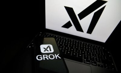 The Grok logo appears on a phone and the xAI logo is displayed on a laptop.