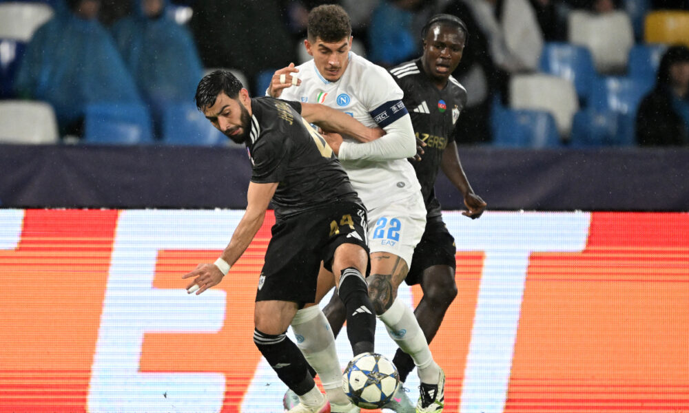 NAPLES, ITALY - NOVEMBER 25: Elvin Jafarguliyev of Quarabag FK battles for possession with Giovanni Di Lorenzo of SSC Napoli during the UEFA Champions League 2025/26 League Phase MD5 match between SSC Napoli and Qarabag FK at Stadio Diego Armando Maradona on November 25, 2025 in Naples, Italy. (Photo by Francesco Pecoraro/Getty Images)
