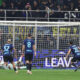 MILAN, ITALY - NOVEMBER 23: Mike Maignan of AC Milan saves a penalty kick Hakan Calhanoglu of FC Internazionale during the Serie A match between FC Internazionale and AC Milan at Giuseppe Meazza Stadium on November 23, 2025 in Milan, Italy. (Photo by Marco Luzzani/Getty Images)