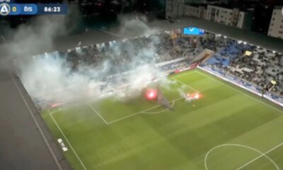 Swedish football match descends into chaos with pitch set on fire and referee hauling players off the pitch