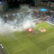 Swedish football match descends into chaos with pitch set on fire and referee hauling players off the pitch