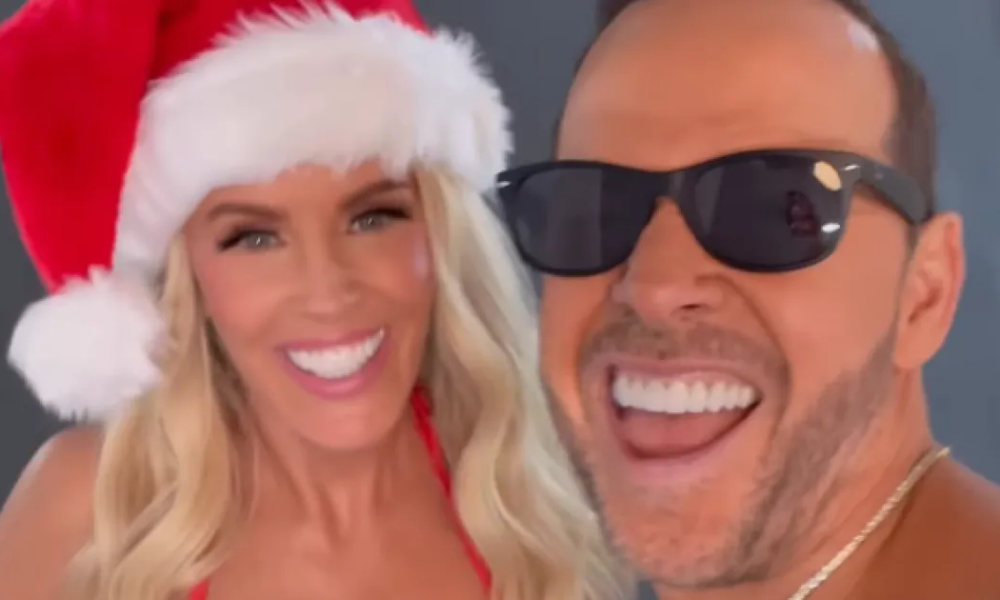 Jenny McCarthy Rocks Red Bikini, Kisses Donnie Wahlberg in Christmas Card