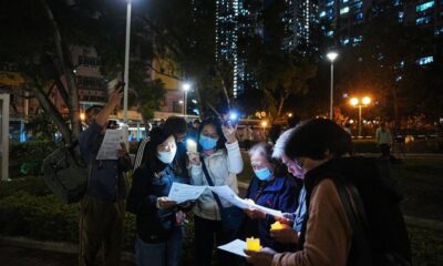 Hong Kong mourns victims of apartment blaze that killed 128 and counting
