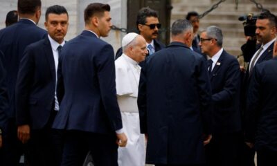 Pope removes shoes but doesn't pray on visit to Istanbul's Blue Mosque