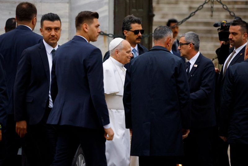 Pope removes shoes but doesn't pray on visit to Istanbul's Blue Mosque