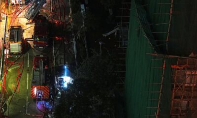 Anger simmers over Hong Kong deadly blaze as Beijing warns against "disruption"