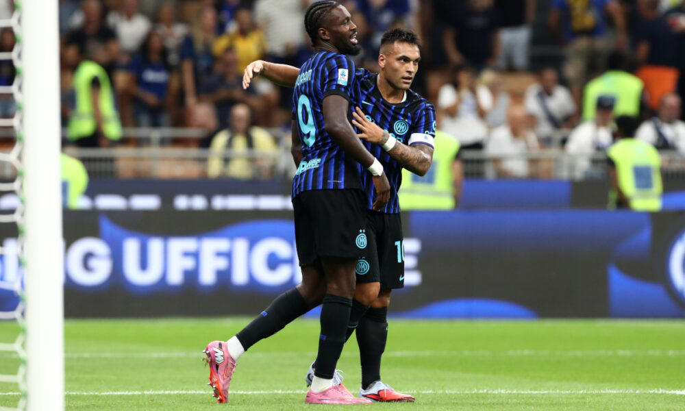 MILAN, ITALY - AUGUST 25: Lautaro Martinez of Internazionale celebrates with teammate Marcus Thuram after scoring his team