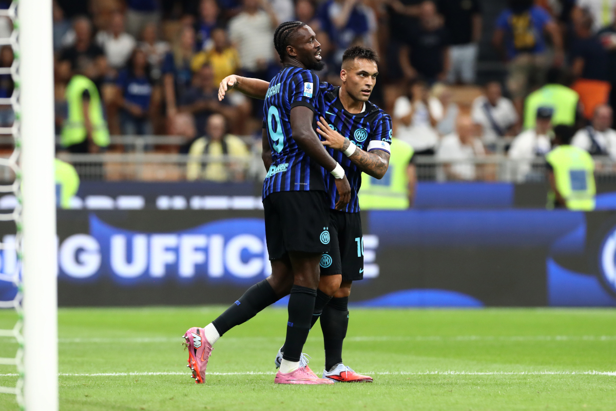 MILAN, ITALY - AUGUST 25: Lautaro Martinez of Internazionale celebrates with teammate Marcus Thuram after scoring his team