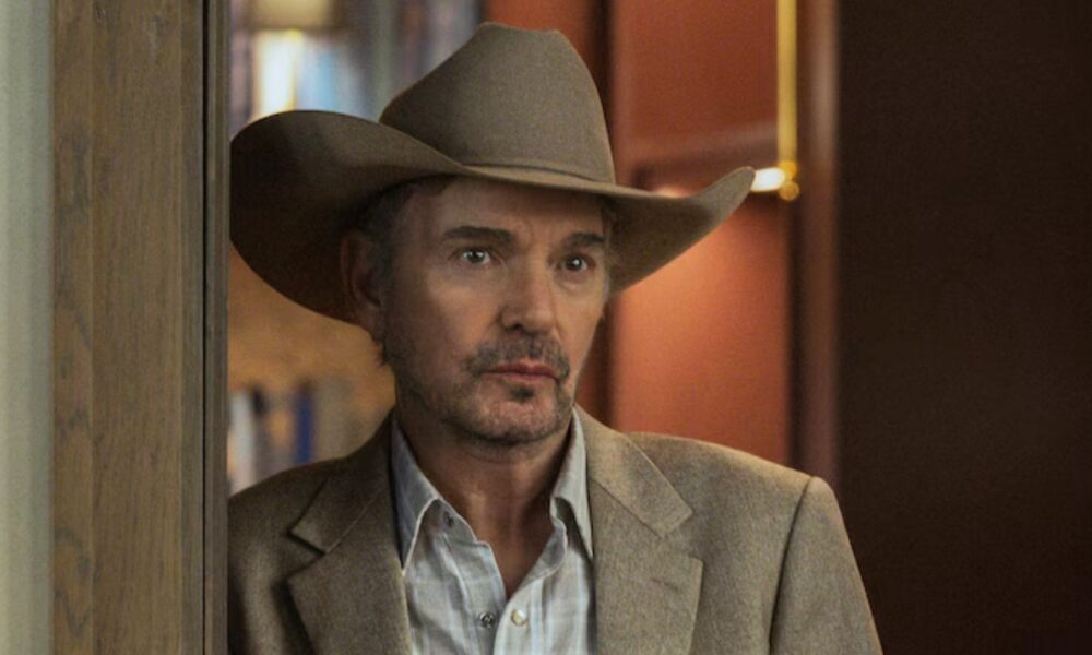 Tommy Norris leans against a doorframe