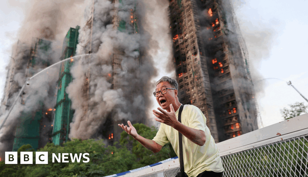 Hong Kong residents react as deadly fire tears through housing estate