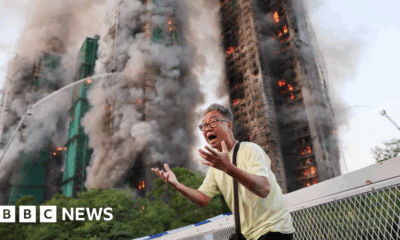 Hong Kong residents react as deadly fire tears through housing estate