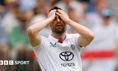 England fast bowler Mark Wood puts his hands on his head