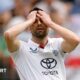 England fast bowler Mark Wood puts his hands on his head