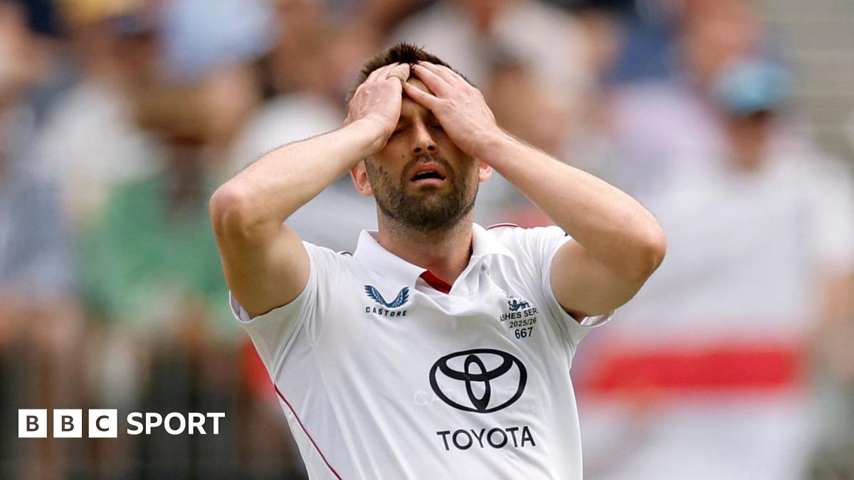 England fast bowler Mark Wood puts his hands on his head