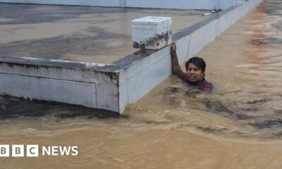 Scores killed and thousands evacuated from record rainfall