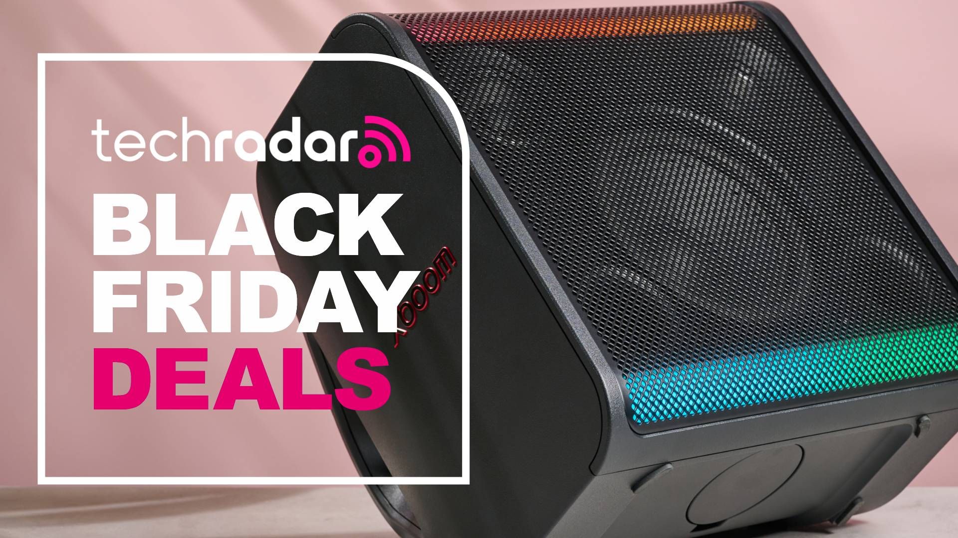 LG xboom Stage 301 on pink background with the words &#039;TechRadar: Black Friday deals&#039; on left side of the image