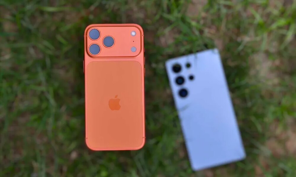 Apple iPhone 17 Pro Max with Galaxy S25 Ultra in background.