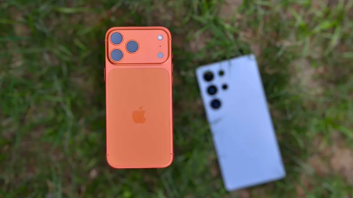 Apple iPhone 17 Pro Max with Galaxy S25 Ultra in background.