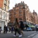 LONDON, ENGLAND - APRIL 22: Pedestrians cross the street near Harrods luxury department store on April 22, 2022 in London, England. The country's Office of National Statistics reported today that retail sales dropped 1.4% in March as the UK's rising cost of living affected consumer spending. (Photo by Hollie Adams/Getty Images)