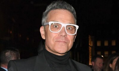 Robbie Williams steps out in chunky white specs after claiming fat jabs are ruining his eyesight