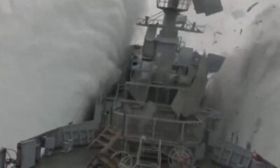 Stunning moment Nato submarine torpedoes frigate in exercise as ship erupts into the air & containers fall off