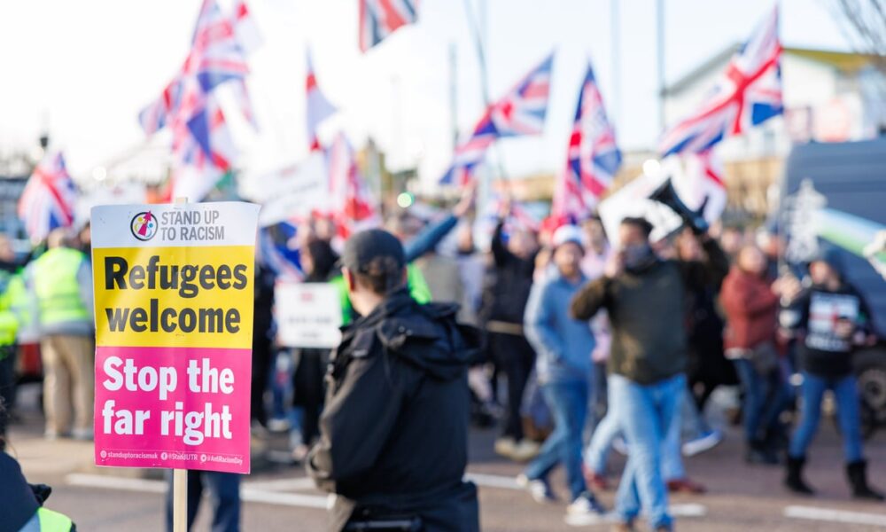 Anti-immigration and anti-racism demonstrators line the streets of Portsmouth in opposing marches