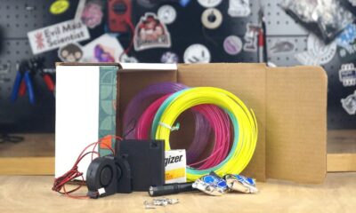 A small 3D-printed air hockey table on a white background