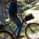 a man on a Rad Power Bike cycling through a wooded trail