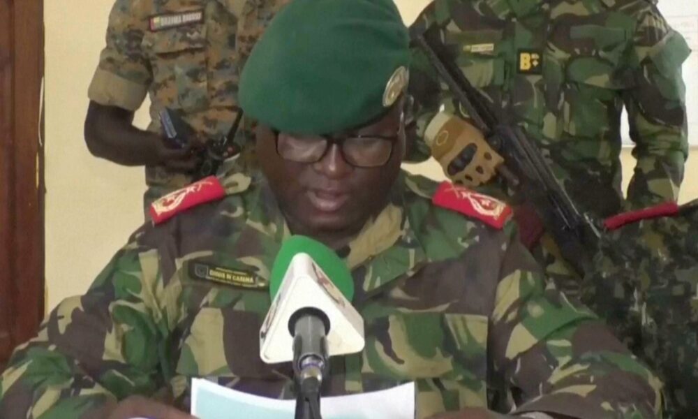 Dinis N'Tchama, military spokesperson, announces the coup on television. Pic: TGB Guinea-Bissau/AP