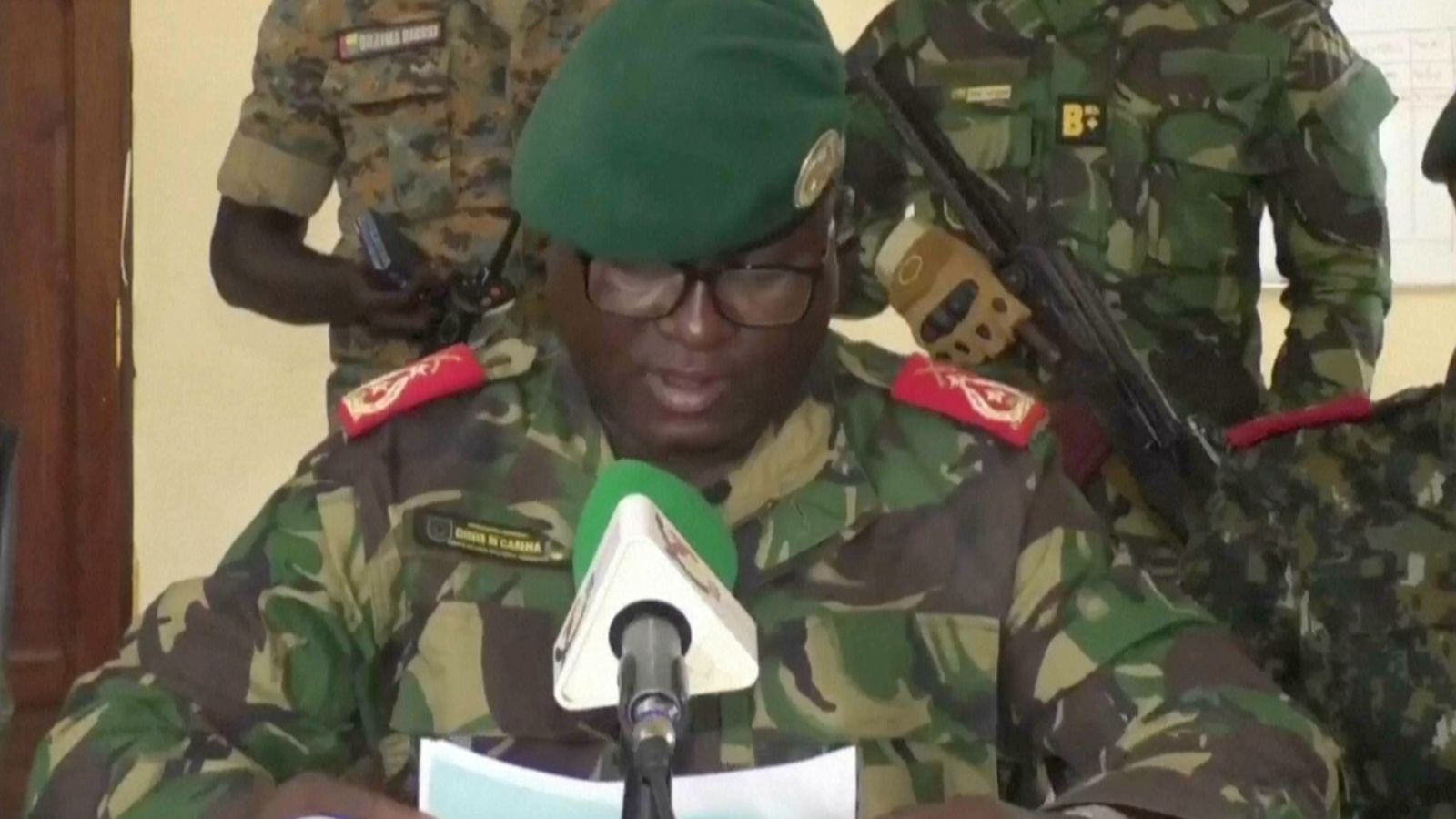 Dinis N'Tchama, military spokesperson, announces the coup on television. Pic: TGB Guinea-Bissau/AP