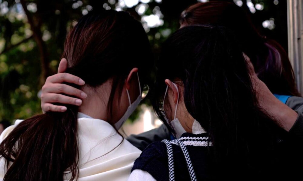 Mourning residents outside Wang Fuk Court