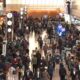 Passengers wait at Haneda Airport in Tokyo after delays from an Airbus software glitch. Pic: AP / NTV