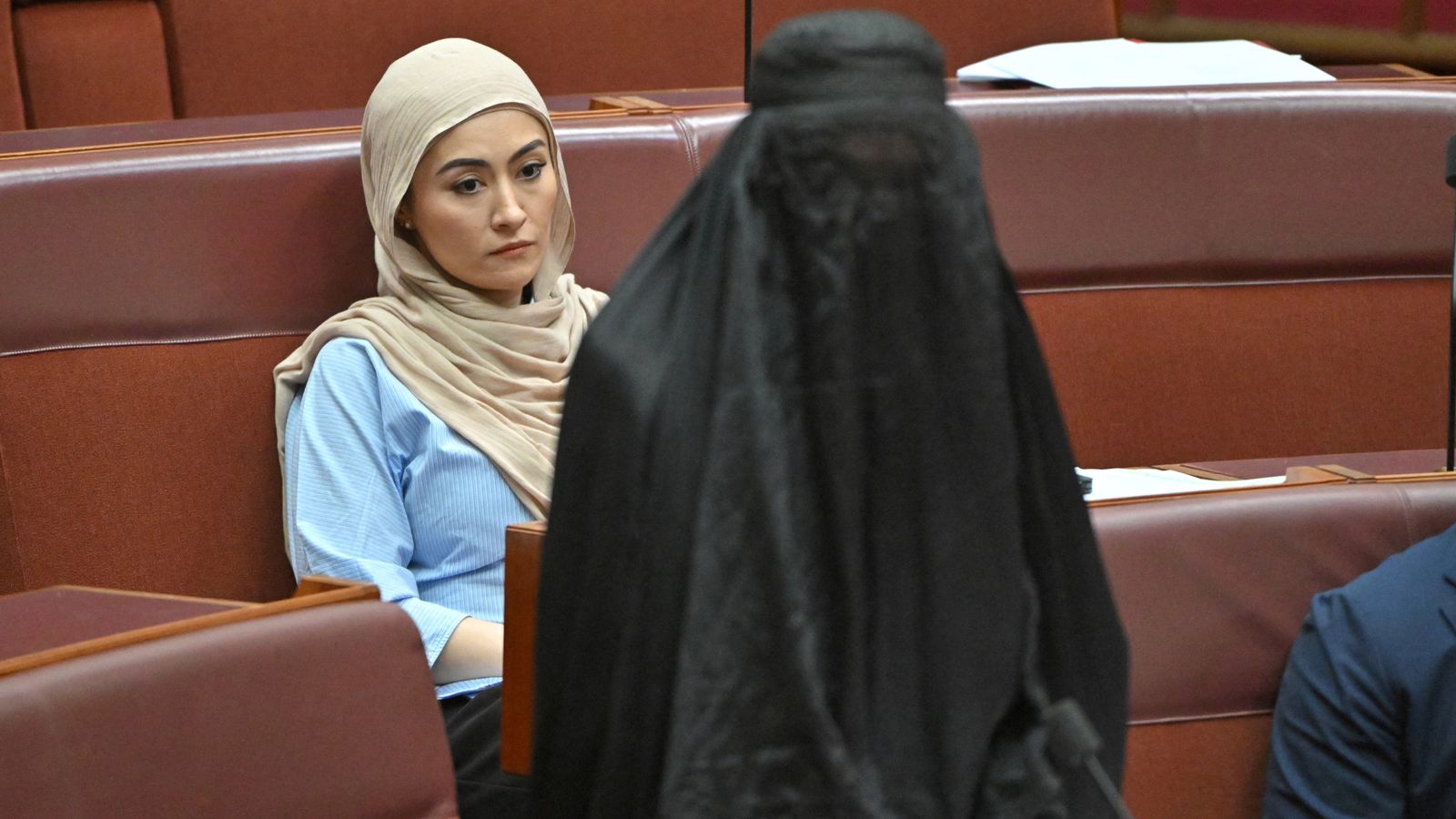 Senators react as One Nation leader Pauline Hanson wears a burka in the Senate chamber. Pic: AAP/Reuters