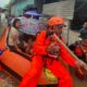 Residents are evacuated from their flooded home in North Sumatra province, Indonesia. Pic: AP