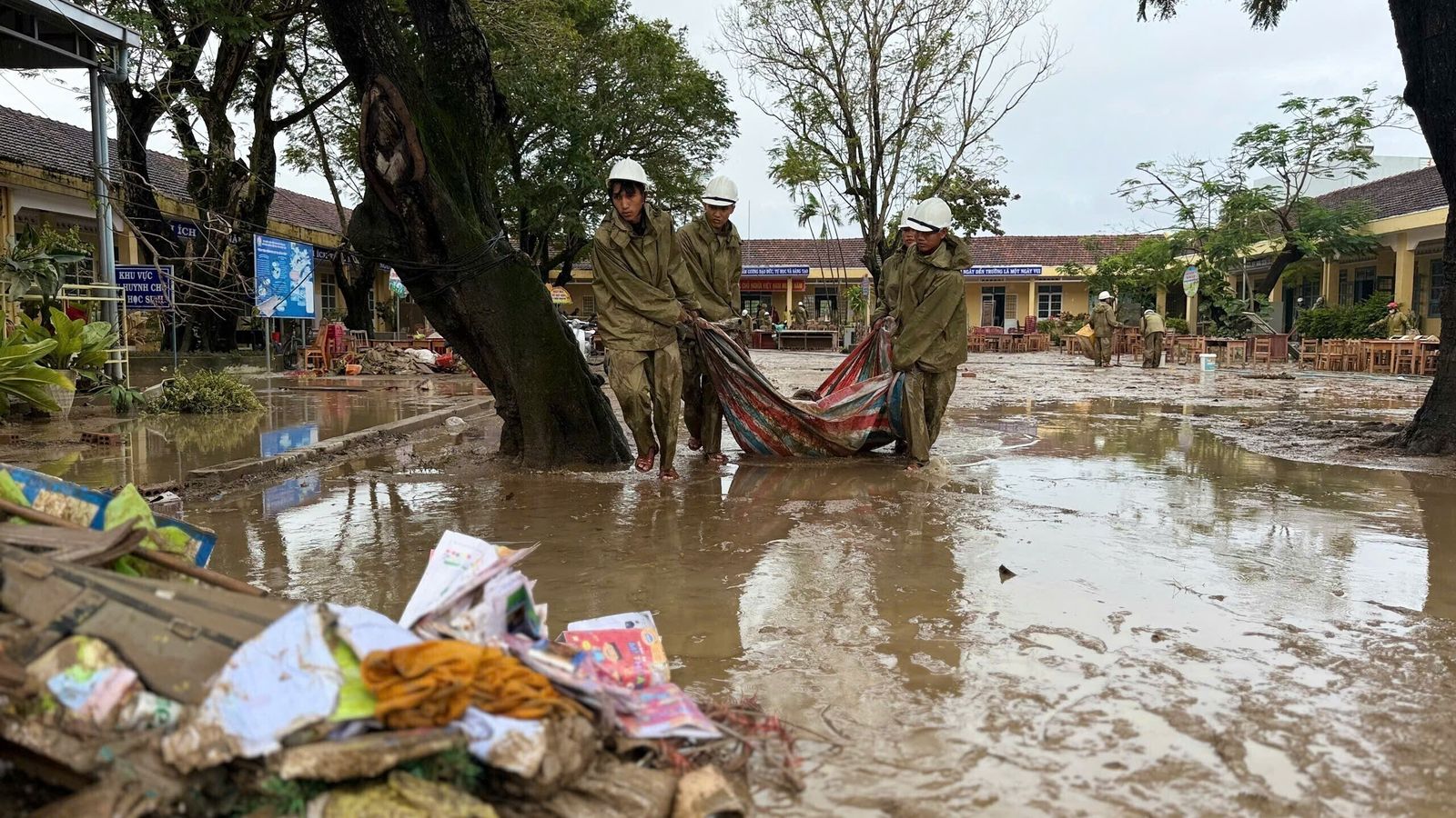 People clean up after flood recedes in Dak Lak on 24 November. Pic: Nguyen Dung/VNA via AP