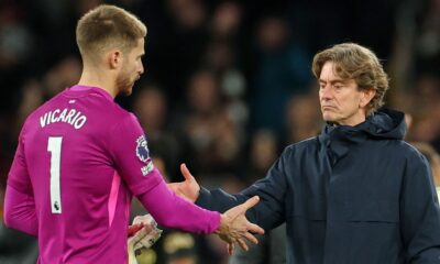 Tottenham head coach Thomas Frank shakes hands with goalkeeper Guglielmo Vicario after the defeat to Fulham