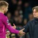 Tottenham head coach Thomas Frank shakes hands with goalkeeper Guglielmo Vicario after the defeat to Fulham