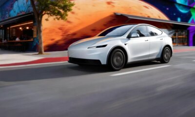 Tesla Model Y Standard model in white driving on a road in LA