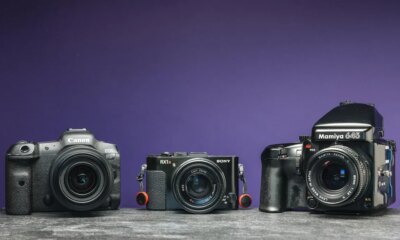 An image of three cameras with a purple background