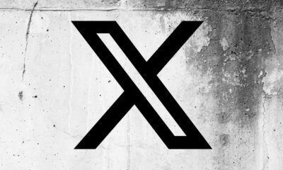 X (formerly Twitter) logo on a cracked wall