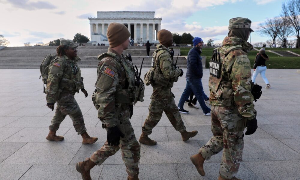 US halts all asylum decisions as suspect in shooting of National Guard members faces murder charge