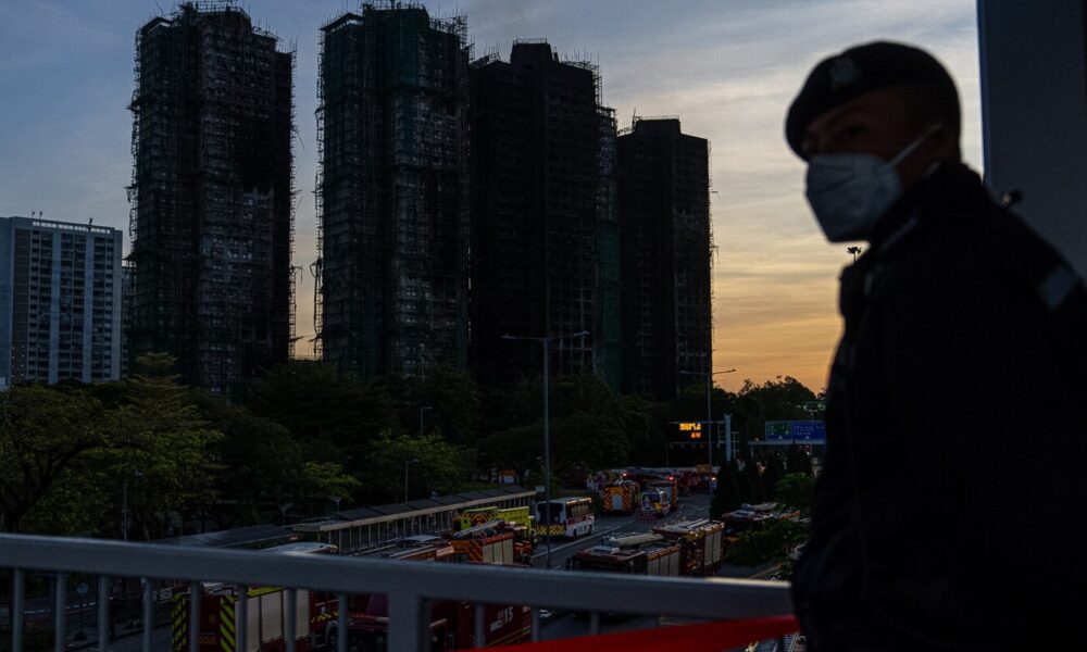 Death toll rises to 128 as Hong Kong firefighters search fire-ravaged towers