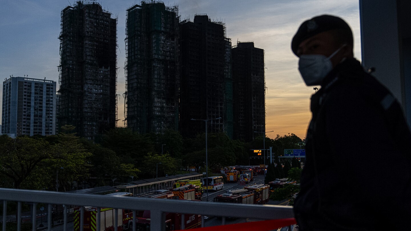 Death toll rises to 128 as Hong Kong firefighters search fire-ravaged towers