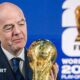 Fifa president Gianni Infantino holding the World Cup