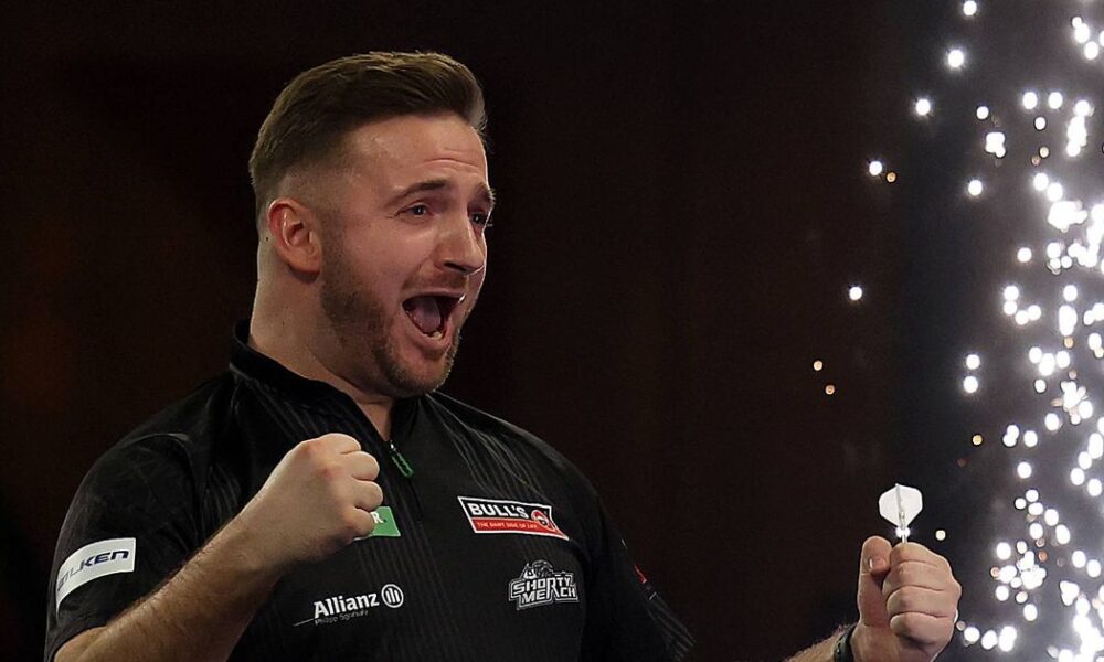 Arno Merk holds his arms outstretched during a walk-on