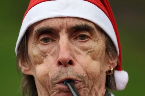 Hundreds of festive runners fill Edinburgh streets for this year's annual Santa Dash